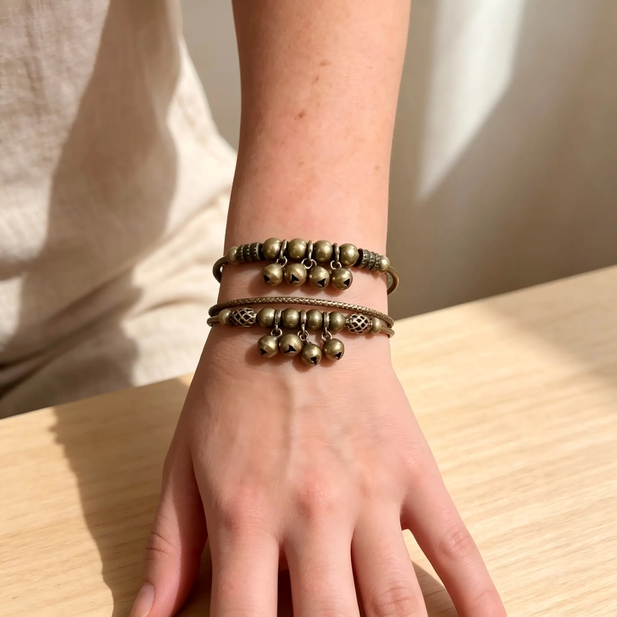 2pcs Vintage brass-colored bell stack bracelet, the gentle and clear tinkling sound of the bells soothes the soul. Retro metal bell bracelet, a female stress-relieving and meditation healing accessory.