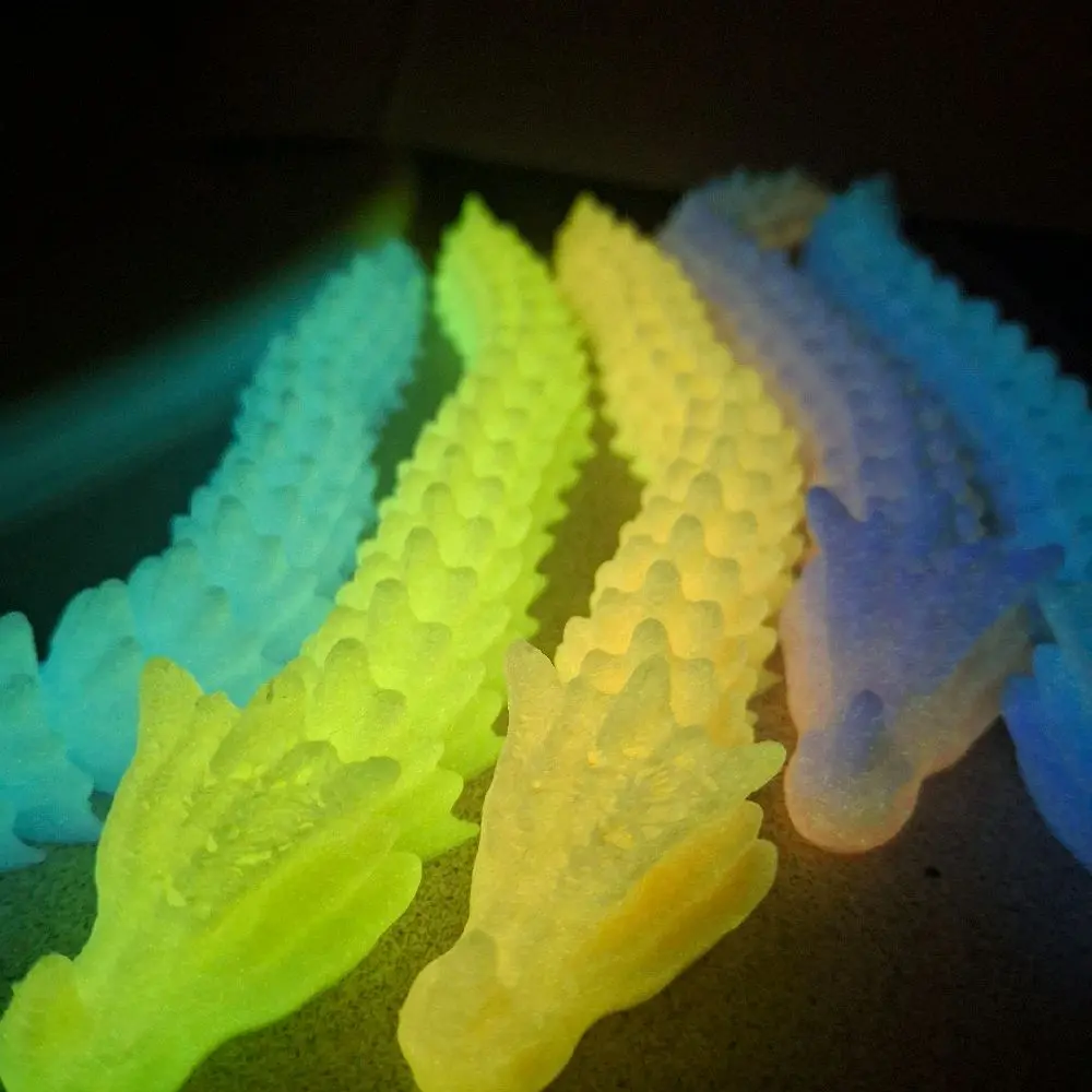 3d printed glow in the dark dragon figets.