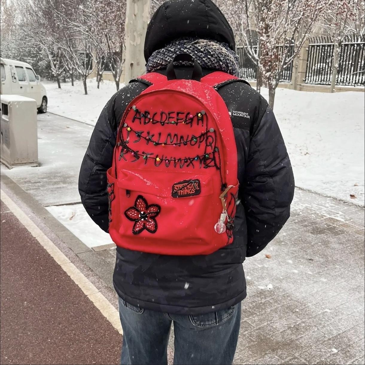 Stranger Things Backpack Shopping Bag Travel Bag Schoolbag Student WorkStudy Backpack Large Capacity Simple Design Red and Black Flower Pattern.
