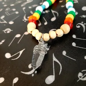Clear Quartz necklace with colorful beaded patterns. 24.5 inch length. All crystals were found by us in nature.