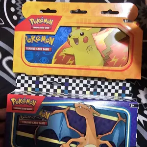 Charizard or Pikachu tin