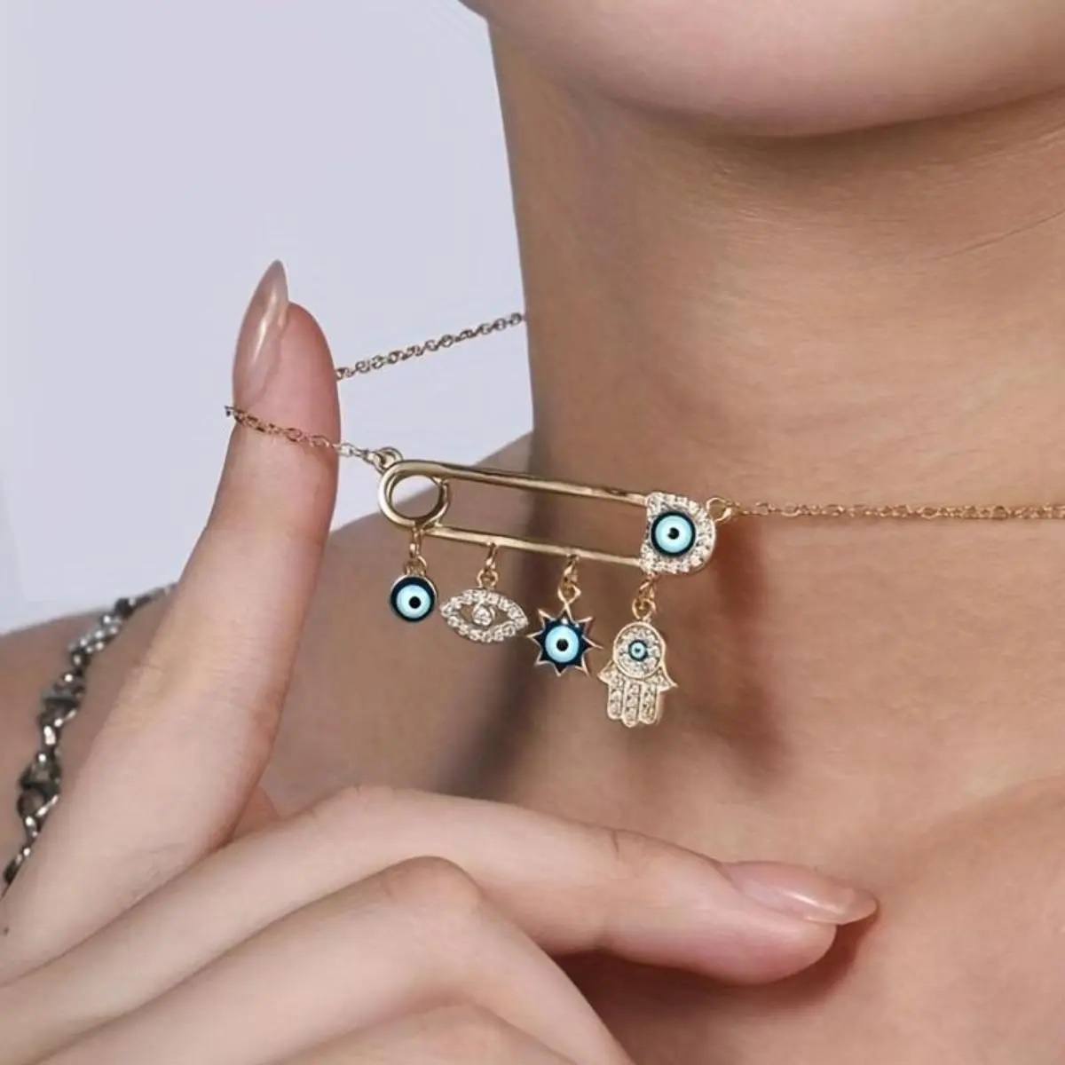 Women's Evil Eye Hamsa Hand Gold-Plated Rhinestone Safety Pin Choker Necklace - Ornate Symbolic Metal Charm Fantasy Bohemian Accessory, Spiritual Protection Amulet, Accessories for Women, Daily Wear or Gifting, Ornate Symbolic Necklaces
