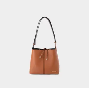 Leather messenger bag with a drawstring closure—stylish, simple, versatile, commuter-friendly, basket-style design
