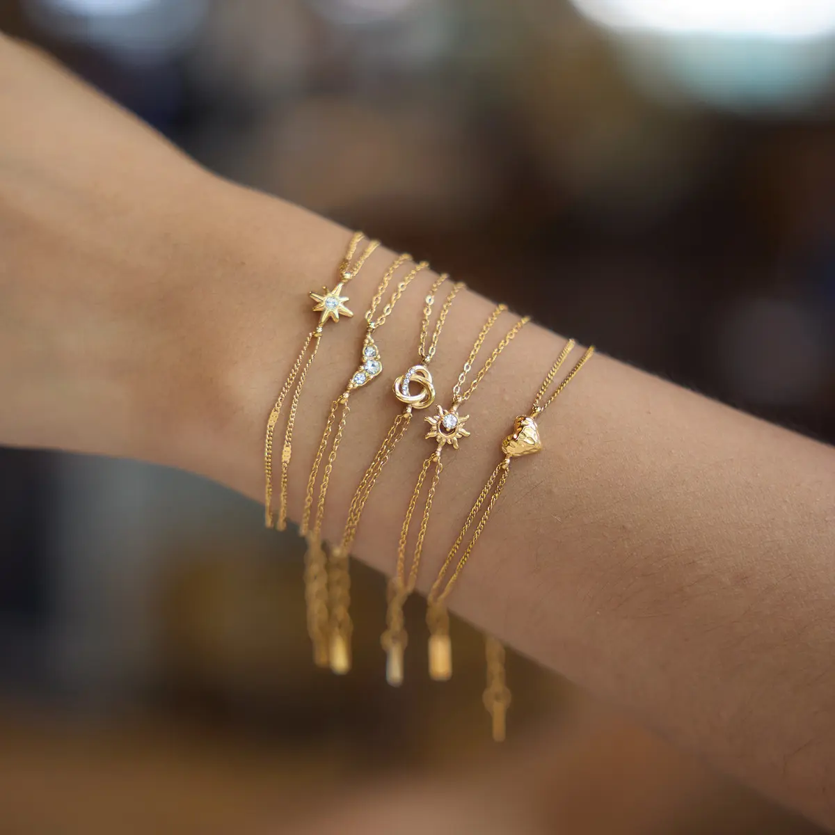 QUEENDO 14K Gold Plated Double Layer Chain Bracelet - Star Sun Heart Knot Charm Bracelet with Sparkly Stone Inlay, Pull-Adjustable Stackable Delicate Wrist Jewelry, Classic Motifs Design Daily Gift for Women