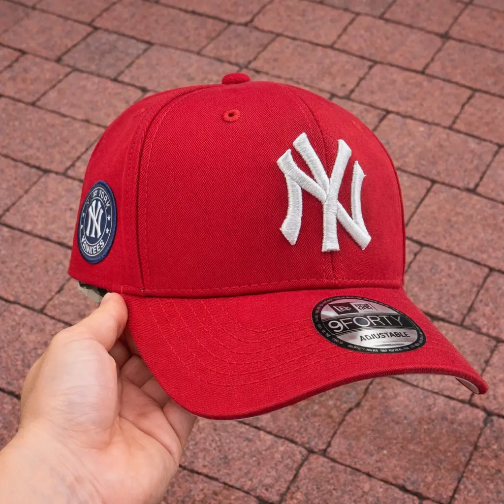 Stylish red curved brim cap with embroidered white NY logo and side Yankees patch – adjustable snapback streetwear ha
