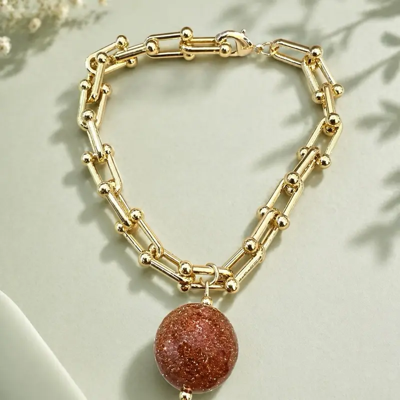 Women's Elegant Gold Tone Chain Bracelet - Gold Aesthetic, Bling Effect Arm Candy Accessory with Sparkling Red Stone Pendant, Arm Candy Accessories