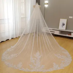 Sparkling sequins and beads are embedded in the train of this exquisite, handcrafted bridal veil