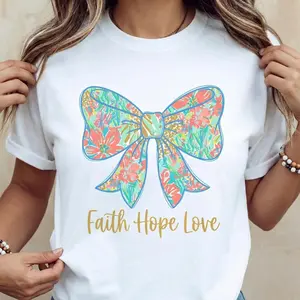 Versatile Summer Cotton Casual T Shirt Featuring Vibrant Cross and Bow Design with He Is Risen Graphic with Short Sleeves and Round Neck Machine Washable Made in USA