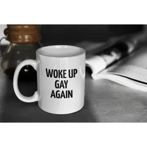 Woke Up Gay Again LGBTQ Pride Mug with Bold Black Text and Rainbow Design Reusable Coffee Cup Suitable for Home Office and Pride Events Perfect Gift for Celebrating Diversity