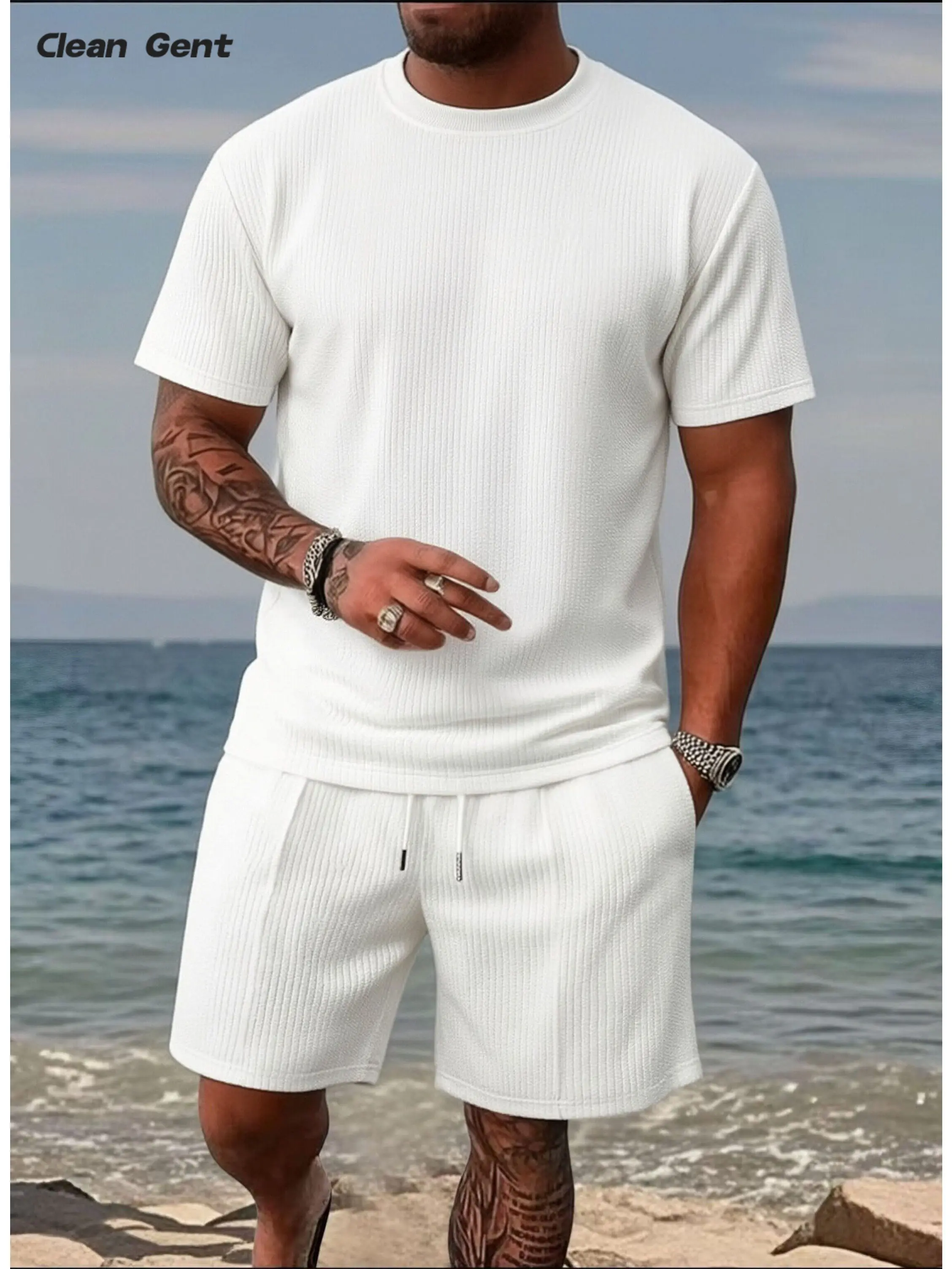 Clean Gent soft knit men’s two-piece set: street-style loose short-sleeve T-shirt + drawstring casual shorts; summer breathable streetwear for men featuring a loose textured knit T-shirt and drawstring shorts; minimalist casual summer outfit.