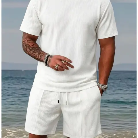 Clean Gent soft knit men’s two-piece set: street-style loose short-sleeve T-shirt + drawstring casual shorts; summer breathable streetwear for men featuring a loose textured knit T-shirt and drawstring shorts; minimalist casual summer outfit.