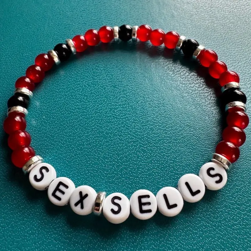 Sex Sells. Hudson Williams. Connor Storrie. Beaded friendship bracelet.