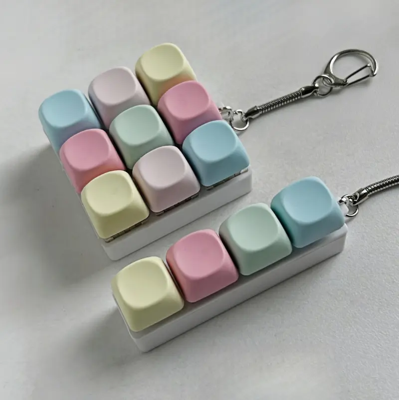 Keyboard-Style Fidget Toy Keychain-Portable Durable Backpack Accessory for Adults with 4 & 9 Key Design and Button Fidget Mindful Fidgeting Aid，Everyday Gift.  Hand Feel. Keystroke Response. Relaxation. Tactile Feedback.  Soft Desk Decor .Crisp Silicone