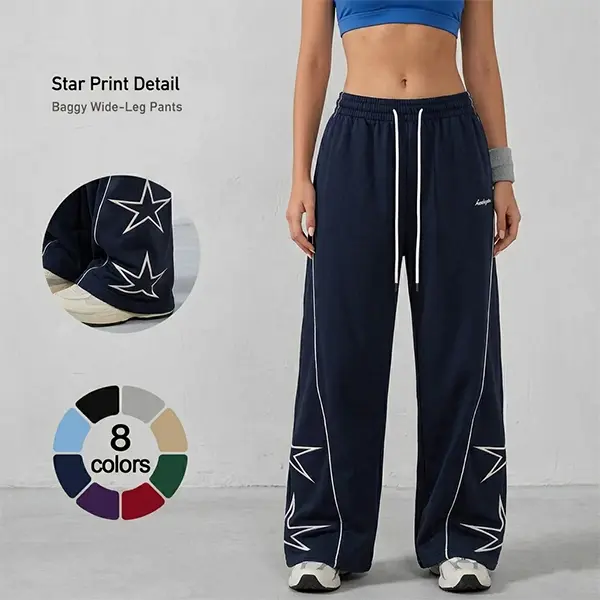 Women’s lightweight athletic pants with a soft, loose fit; oversized women’s long pants featuring gray side panels and five-pointed star prints; comfortable design in a sporty casual style—ideal for gym wear; unisex.