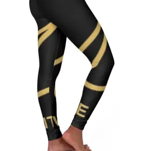 Marx Dublin Gold Script Logo High Waist Leggings : these high waist yoga leggings blends bold , statement- making style with movement ready performance. The deep black base & sweeping gold script create a luxe graphic look .