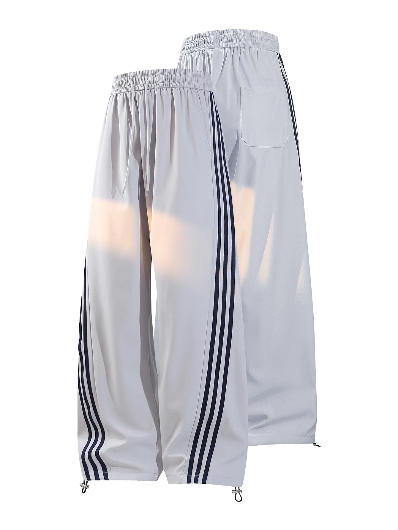CCCMAI Men's color-block side stripe sports pants, all-season men's casual fashion trendy straight-leg pants with drawstring waistband, classic menswear sweatpants, loose casual pants, stylish activewear for men. Striped