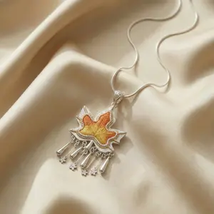 ”Ethnifly“Chinese Minority Artisan Maple Leaf Charm