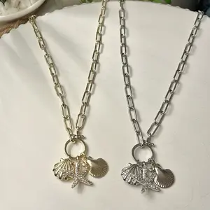 The Andi Charm Necklace seashells and starfish Charms