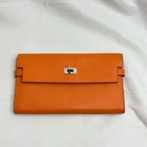 Pre-owned HERMÈS leather Mini Bags Orange Chèvre Kelly Long Wallet