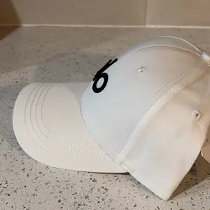 Performance District Trucker Hat, Off-Duty Cap Black Baseball with White Letter "O" Design - 100%25 Polyester, Sun Protection & Fit for Outdoor Running and Activities, Outdoor Headwear Minimalist Baseball Durable Woven cap