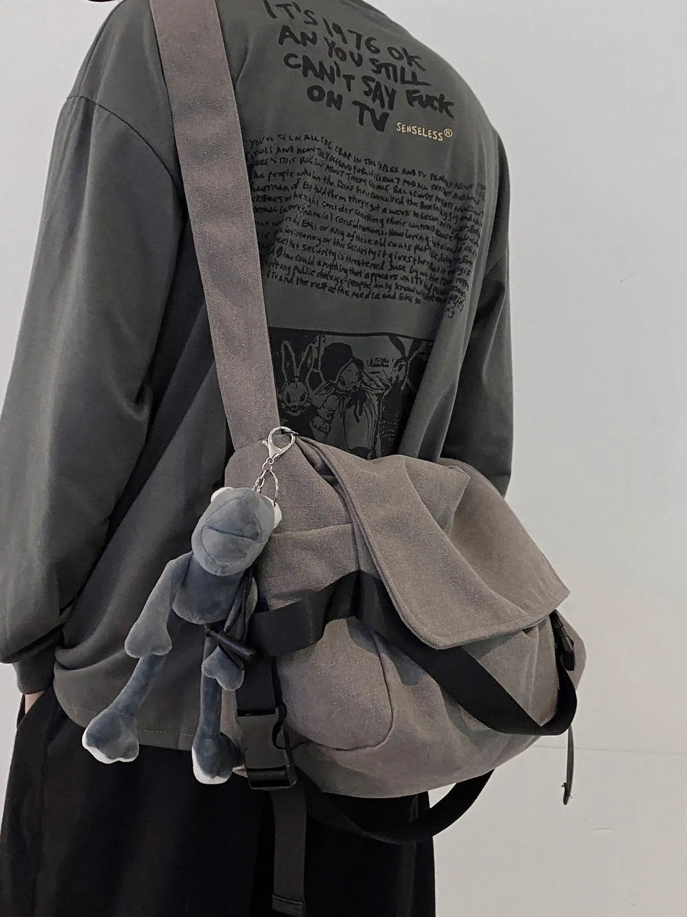 Stylish Plain Canvas Adjustable Crossbody Shoulder Bag for Men with Cartoon Charm Large Capacity Shoulder Bag Perfect for Work and School Commute Casual Fashion Bag Fashionable Casual Bag