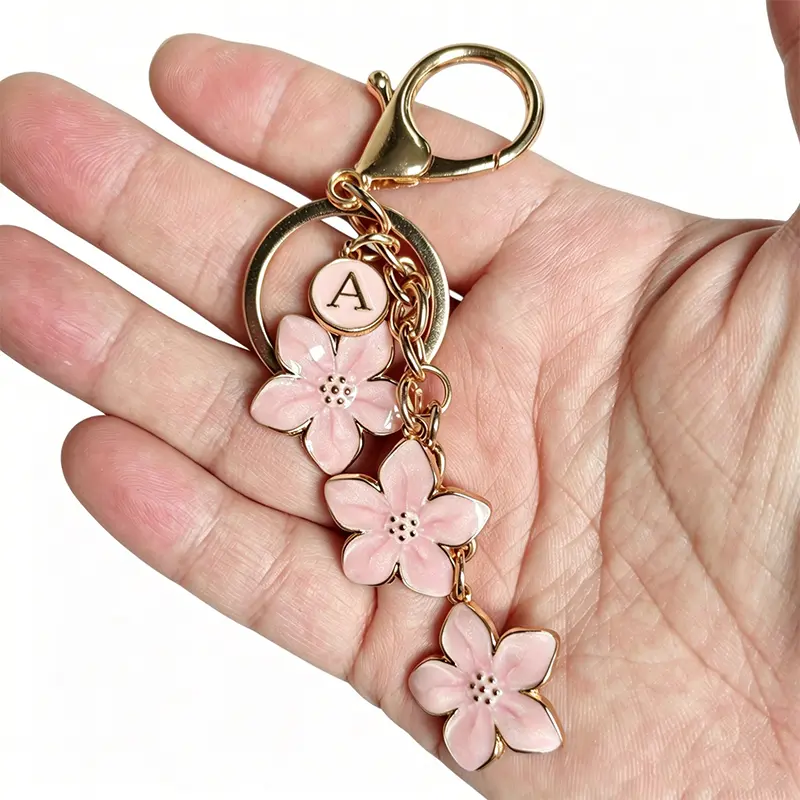 Fashionable Alloy Keychain - 26 Letter Charm Options (Incl. Letter A), Trendy Cute Cherry Blossom Decoration Pendant for Simple Clean Style Student Backpacks, Crossbody Bags, Mobile Phone Handbags (Sports & Outdoor Camping Hiking Accessory)