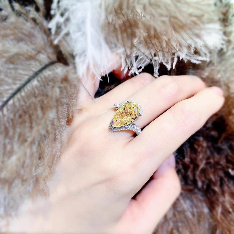 yellow A luxurious hand polished Moissanite ring paired with yellow zircon. Exquisite craftsmanship.Sparkling Moissanite and yellow zircon. Master level aesthetic design. Excellent quality. Brilliant and radiant. High quality hand polished.