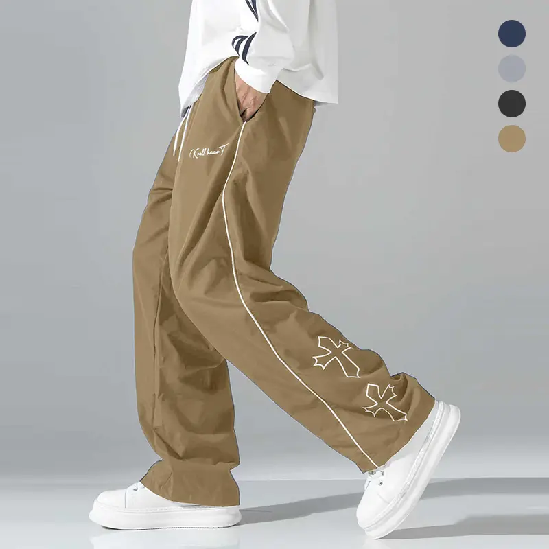 Men’s color-block sweatpants, white side stripes and embroidered design, casual fitness wear, loose athletic pants, trendy street-style jogger pants, drawstring waistband, straight cut.