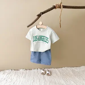 Two-piece summer versatile baby clothing alphabet patch light green short sleeves + loose denim shorts baby sports suit