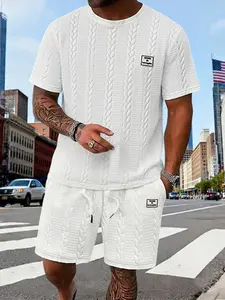 Men's summer knit two-piece set: crew neck short-sleeve T-shirt and drawstring shorts. The loose fit and minimalist logo patch are designed to provide a comfortable wearing experience and a stylish, simple look for urban commuting and casual outings.