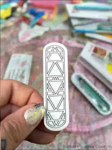 Mad Meadow’s Elemental Sticker with Geometric Triangle Pattern