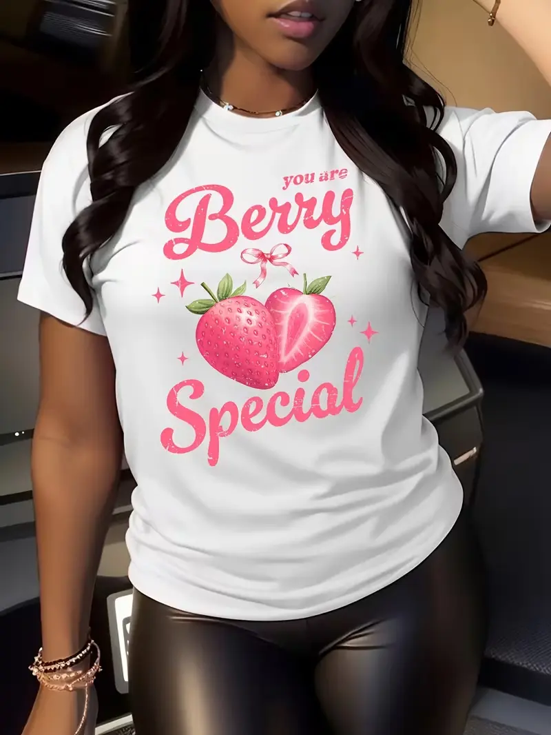 Women's strawberry-print T-shirt—designed for strawberry lovers; a casual, short-sleeved crew-neck top featuring a distinctive berry pattern and pink lettering; machine-washable, strawberry-themed style.