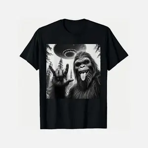 T - Shirt With Bigfoot Making Rock Sign And Ufo Graphic Blending Cryptid Mystery And Fun Vibe Unique Casual Wear T-Shi True Fit Cotton T-Shirt