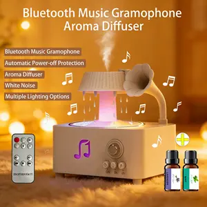 Phonograph-style aroma diffuser and humidifier with white noise and Bluetooth music, includes essential oils, features multiple natural sounds, automatic shut-off when water runs out, and ultrasonic raindrop rotation. A high-end white aroma diffuser gift.