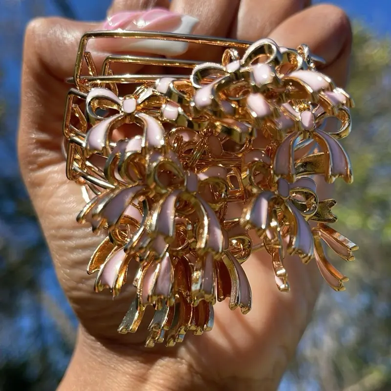 Pink and Gold Bow Charmed Bangle Bracelets - Elegant Design with Floral Accents and Gold Finish
