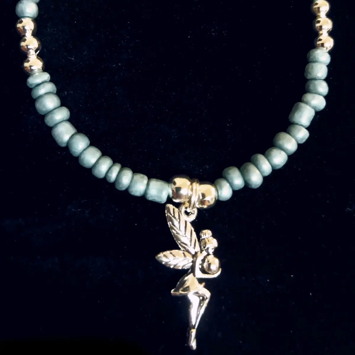 Navajo Handmade Silver Tinkerbell Charm Bracelet with Aqua Beads