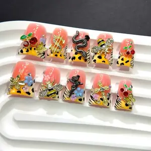 Set of 10 Summer-Themed Orange Short Duckbill Nails Featuring a Leopard And Zebra Print, Perfect for Y2K Style