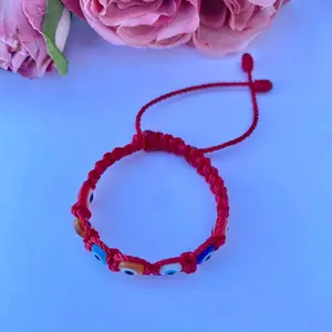 Pulseras de bebe tejida con hilo y ojo turco multicolor