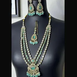 Elegant Three Layer Kundan Necklace Set with Mint Green Accents.