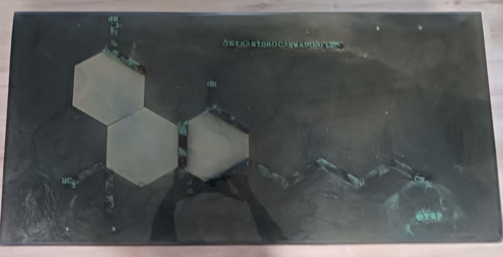 Cross Legs epoxy table featuring the tetrahydrocannabinol compound in multiple layers of epoxy providing a deep tridemtional feel