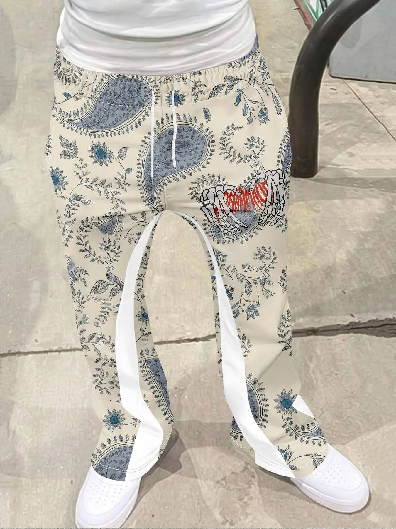 1 piece of men's high street retro, Casual Street Comfy, Vintage bell bottom pants with Paisley and Geometric pattern, paired with plant flowers. Base color light beige, with blue and white as main colors, blending retro and street, Casual Fashion Comfy
