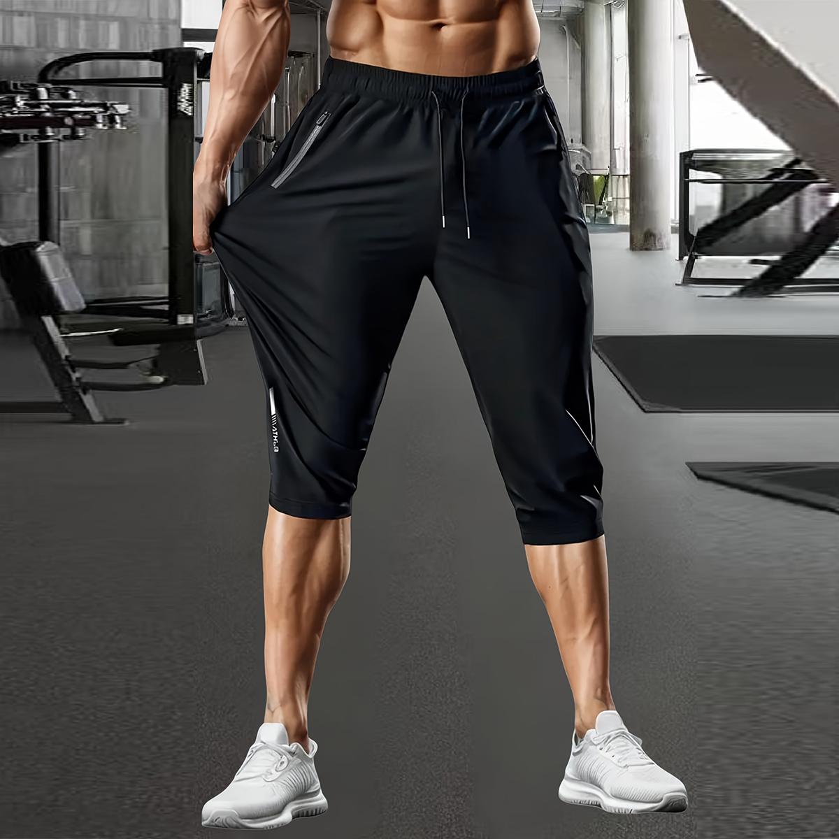 Men's casual stretchable ice silk fabric breathable waist drawstring, zipper pocket fashion sports capri pants with reflective print. Basic comfortable quick-drying breathable outdoor running, cycling, training and sports capri pants.