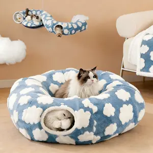 Cat Tunnel Bed – A cozy experience designed for cats and dogs of all sizes. Includes a peek-a-boo cave for kittens, puppies, and rabbits. Available in multiple sizes, made of polyester — a fluffy cloud bed with calming benefits.