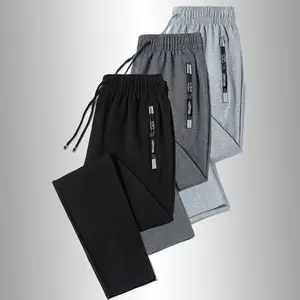 Men’s casual athletic pants with zippered pockets and a drawstring waist, solid color design suitable for all seasons, ideal for casual wear, relaxing at home, and outdoor activities