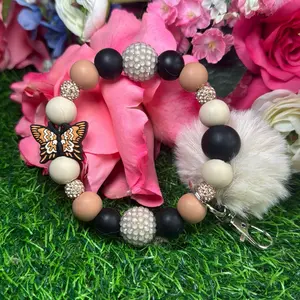 Kaki flutters wristlet keychain color scheme peanut butter, off nude, black and bling beads made with wire