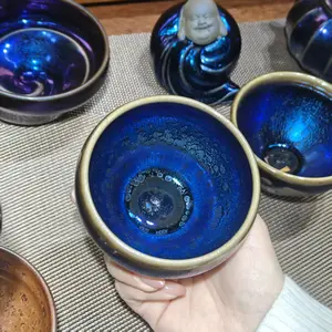 Master Wang, a renowned Jianzhan tea cup craftsman, hand-crafts tea cups and master pieces