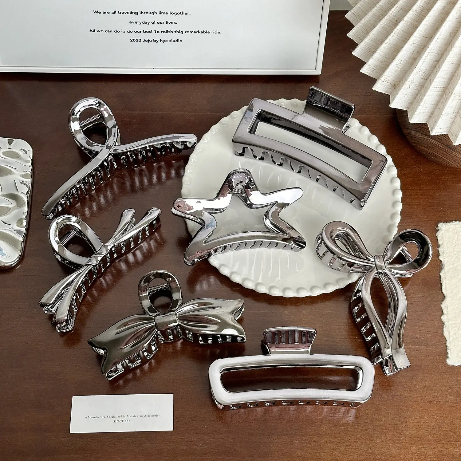 Premium-look metallic silver resin hair clip—large claw clip suitable for updos, ponytails, and versatile styling.