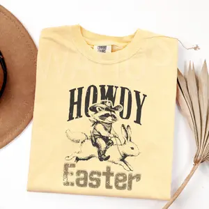 Comfort Colors T-Shirt 1717 Howdy Easter, Western Easter, Cowboy Raccoon, Cowgirl, Trendy Holiday Gift For Her S1 Tee