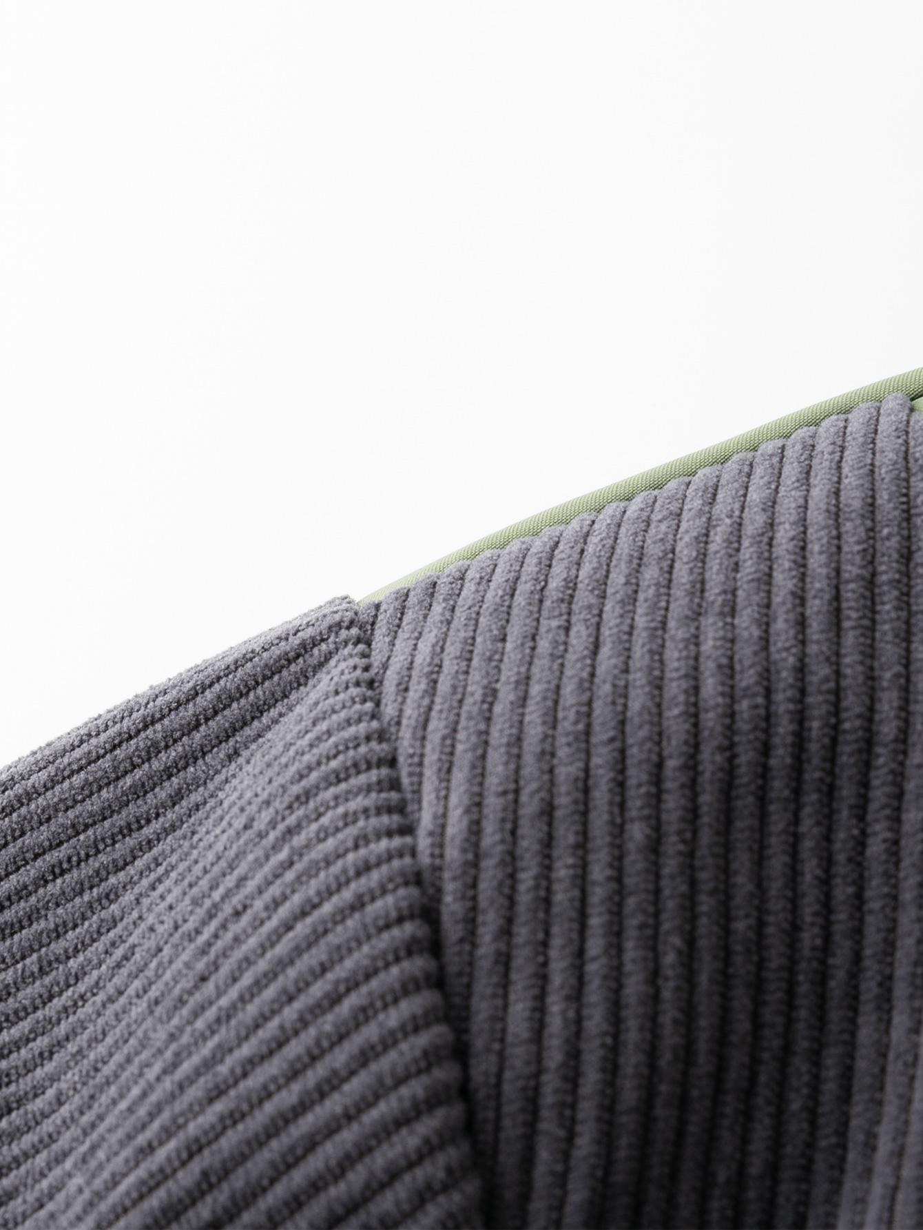 A collared jacket with a patchwork style, visually layered and designed to flatter necklines. The buttoned closure makes it easy to put on and take off. There is one pocket on the left side which is both practical and decorative