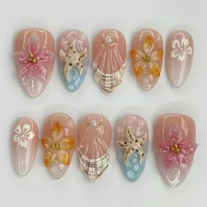 Soft Peach Beach Inspired 3D Nail Set with Starfish, Seashell Details, Translucent Floral Art and Glossy Jelly Finish on Almond Tips for a Summer Coastal Look
